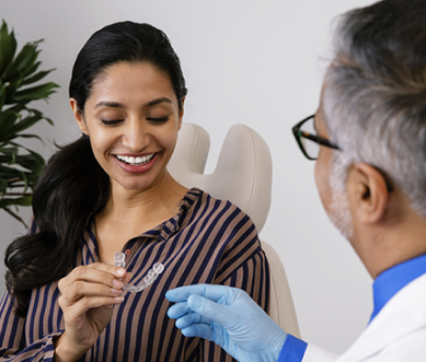 a doctor introduces a invisible aligners for a girl